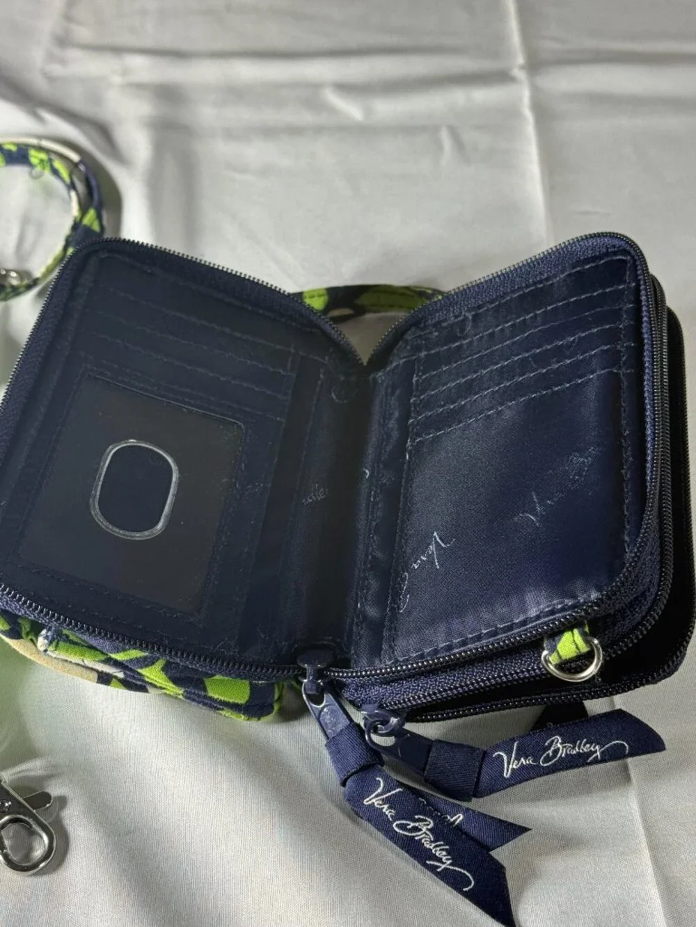 Vera Bradley Green Leaves and White Flowers Wristlet Wallet.